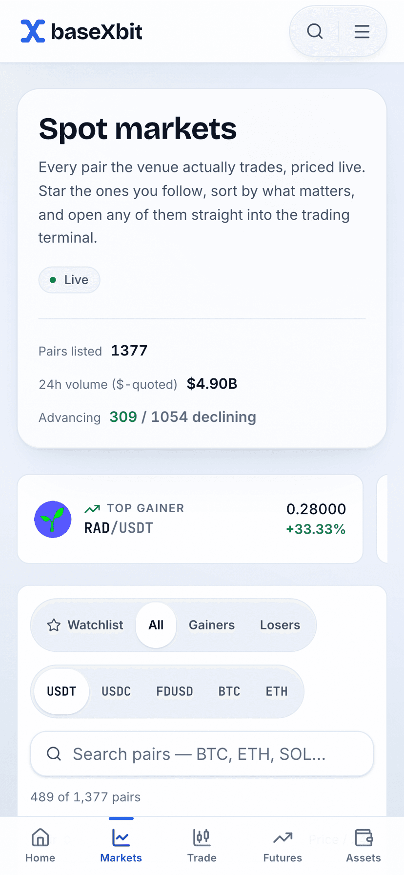 The binXbase markets board on a phone, listing the same live pairs